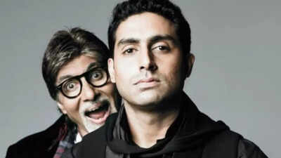 Amitabh Bachchan attentively listens to his son Abhishek in the studio