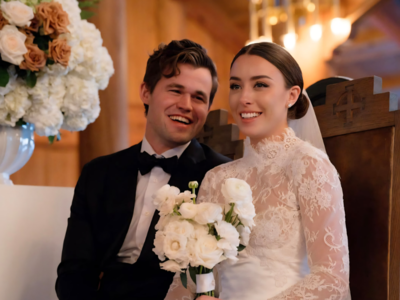 Magnus Carlsen celebrates freestyle chess rating with his wife.