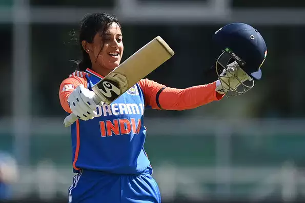 Smriti Mandhana celebrates her first T20I century against England.